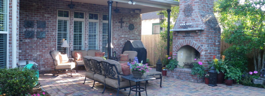 backyard seating area and courtyard with brick fireplace