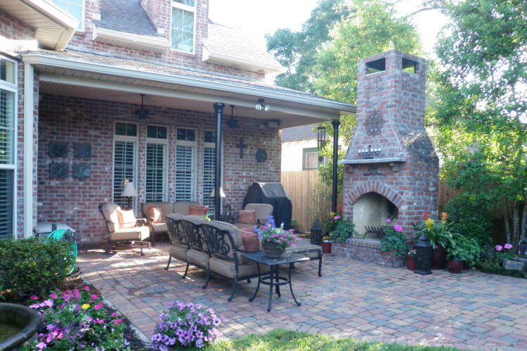 backyard seating area and courtyard with brick fireplace