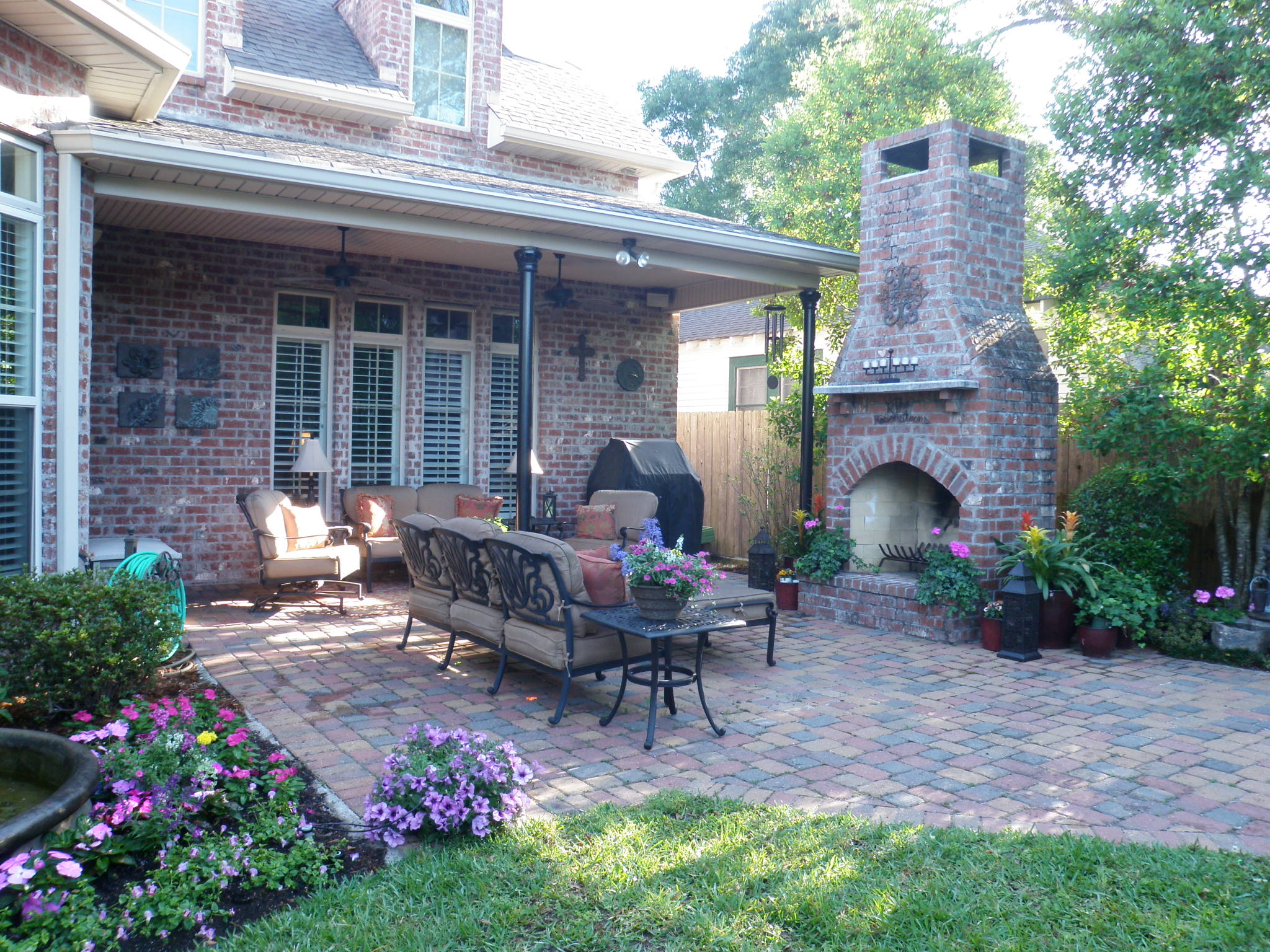 backyard seating area and courtyard with brick fireplace